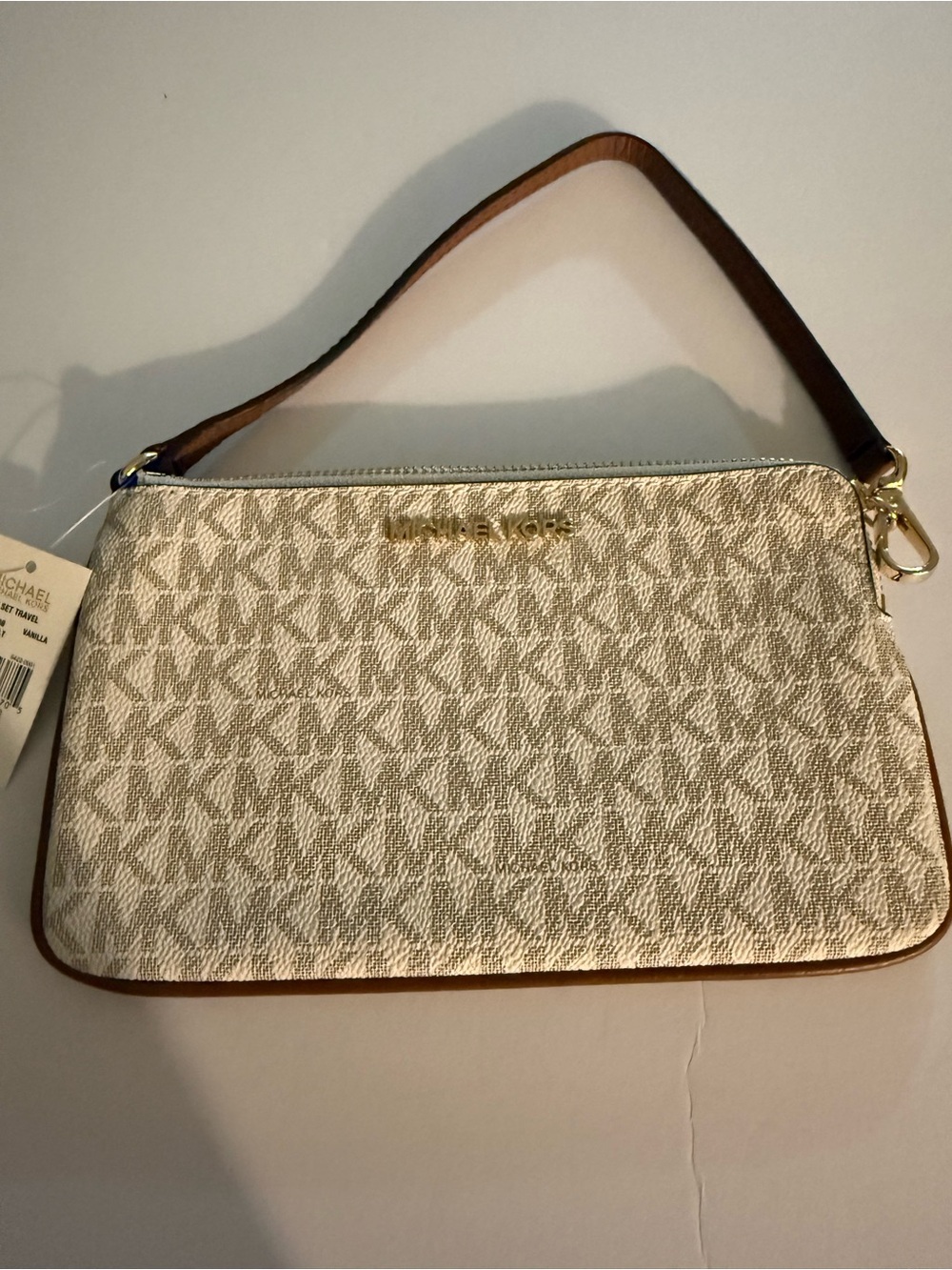 Michael Kors Jet Set Large  Signature Canvas Wristlet. Vanilla